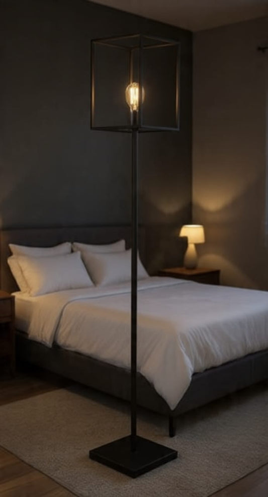 Modern industrial floor lamp with open metal frame and sleek design, perfect for contemporary living spaces.