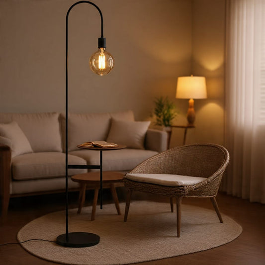 Modern industrial floor lamp with integrated side table from Sellixpk Furniture Hub, featuring a sleek metal finish and functional design.