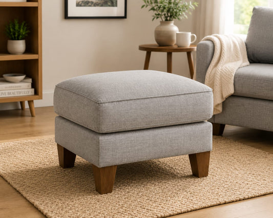 Modern upholstered ottoman footrest stool by Sellixpk Furniture Hub with plush fabric and wooden legs.